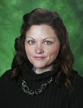 Photo of Jessica Luther Rummel with a green background