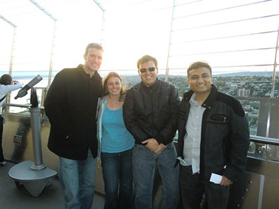 Four friends standing together on a viewing platform