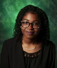 Photo of Fre'Dasia Daniels with a green background
