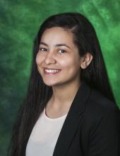 Photo of Stephanie Gonzalez with a green background