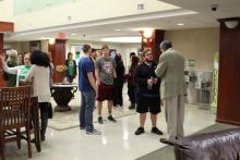 Dr. Duban greeting students in the Honors Hall lounge